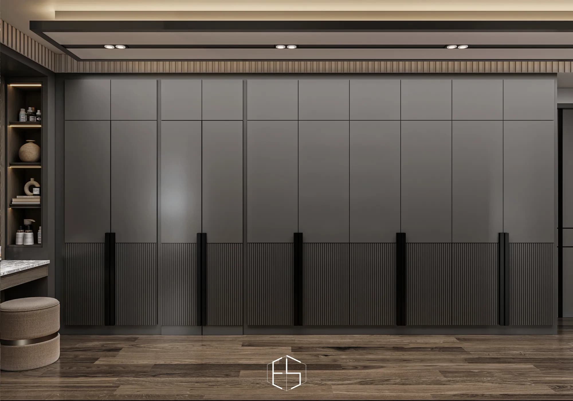 Quantis Signature: Full-height grey wardrobe doors combine smooth upper panels, ribbed lower sections and long black handles beside a dressing table.
