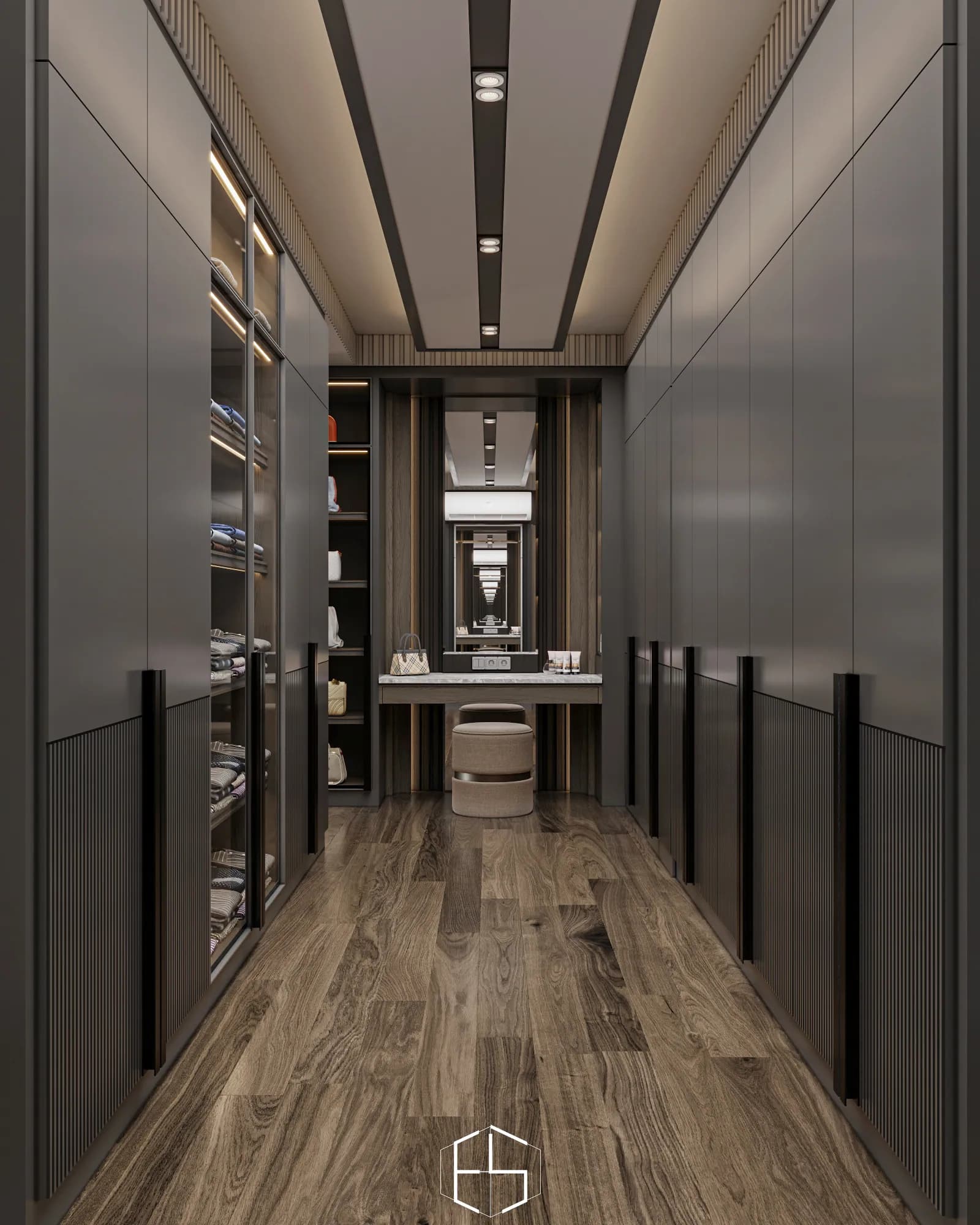Quantis Signature: Two parallel wardrobe banks lead to a dressing-table alcove with a round stool, tall mirror and illuminated accessory shelves.