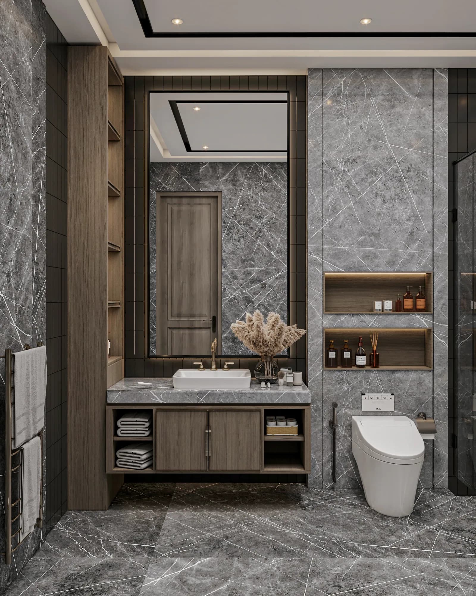 Family Residence: The dark bathroom combines grey veined surfaces, wood-toned vanity storage and black wall tiles, with a tall mirror and lit niches above the toilet.
