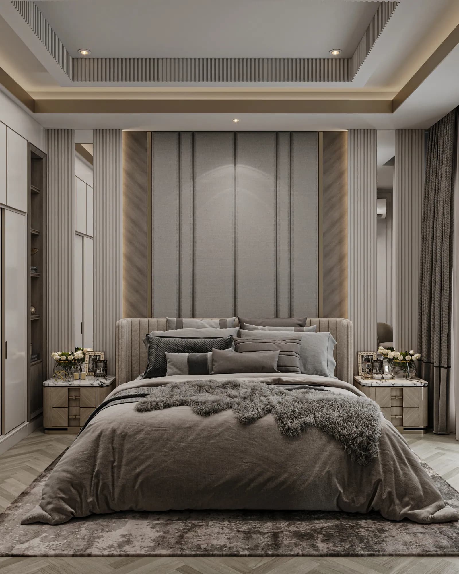Family Residence: Tall padded wall panels frame the bed, with mirrored strips, vertical fluting and matching bedside drawers on both sides.