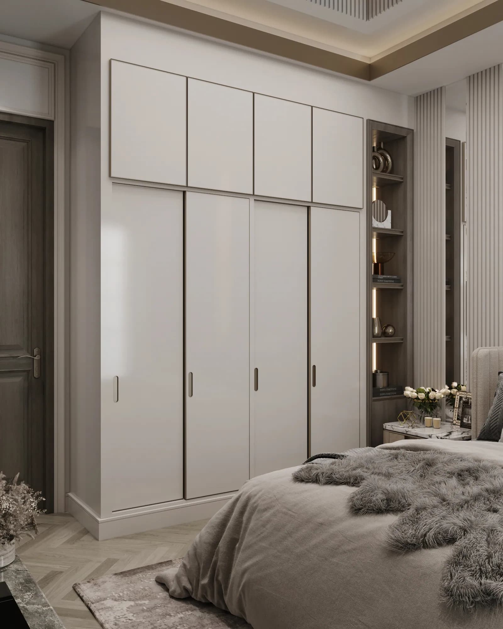 Family Residence: Pale wardrobe doors and overhead cupboards form a continuous storage wall beside a narrow illuminated display shelf.
