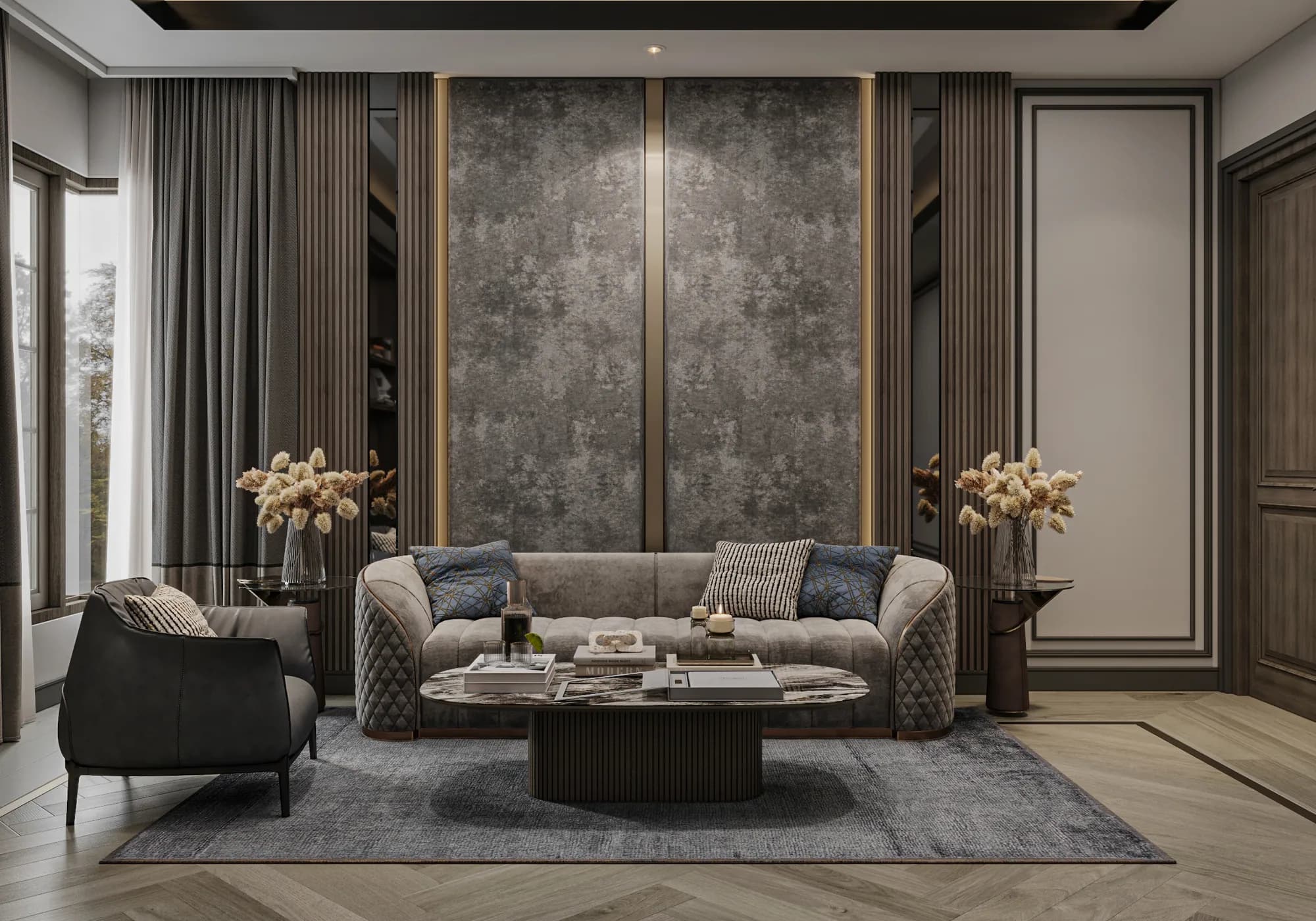 Family Residence: A quilted curved sofa and armchair form a sitting area against tall textured panels, mirror strips and dark vertical fluting.