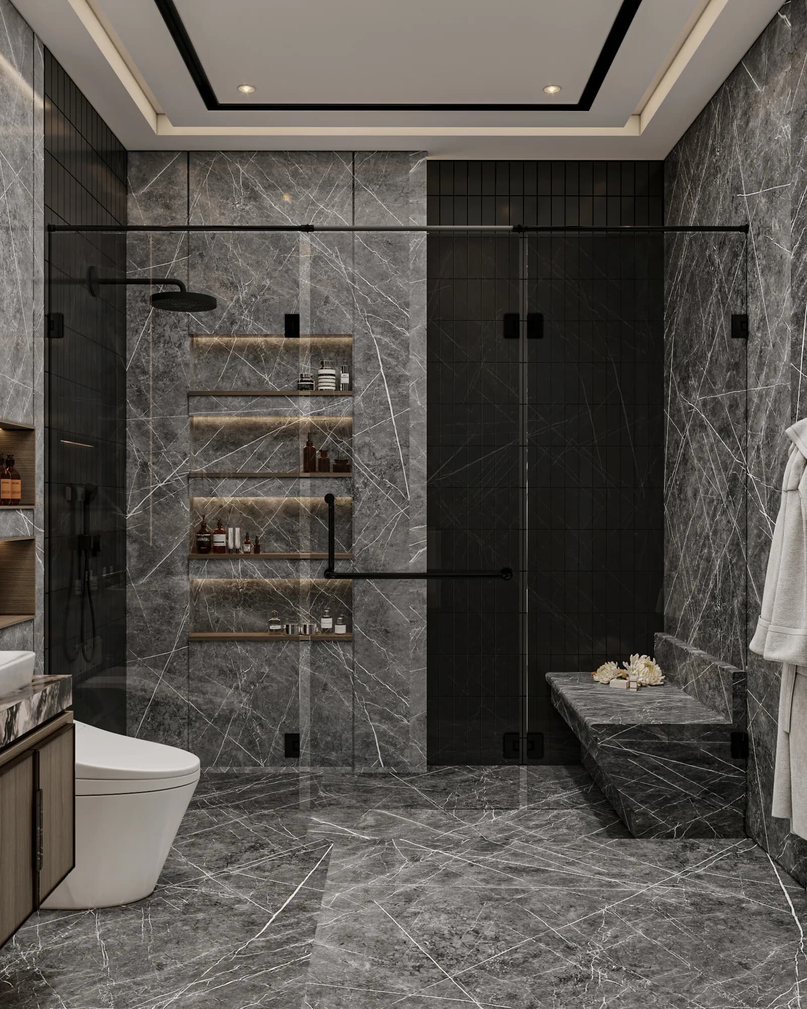 Family Residence: A glass shower enclosure pairs dark fixtures with illuminated recessed shelves and a built-in bench against grey veined surfaces.
