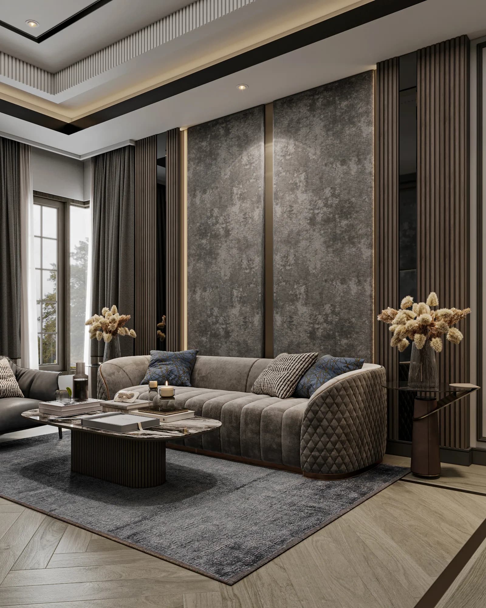 Family Residence: The sitting area's curved quilted sofa is paired with a rounded veined coffee table, slim side tables and blue accent cushions.
