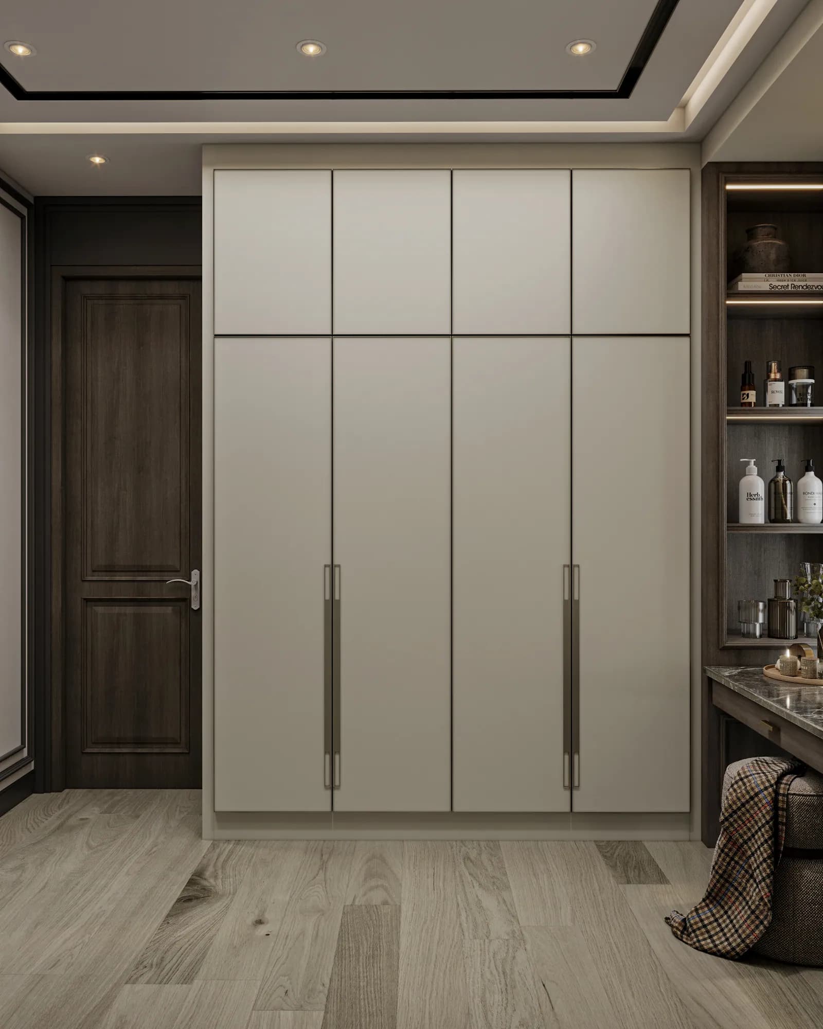 Family Residence: A pale wardrobe with long slim handles sits beside the dressing table, contrasting with the darker door and illuminated open shelving.