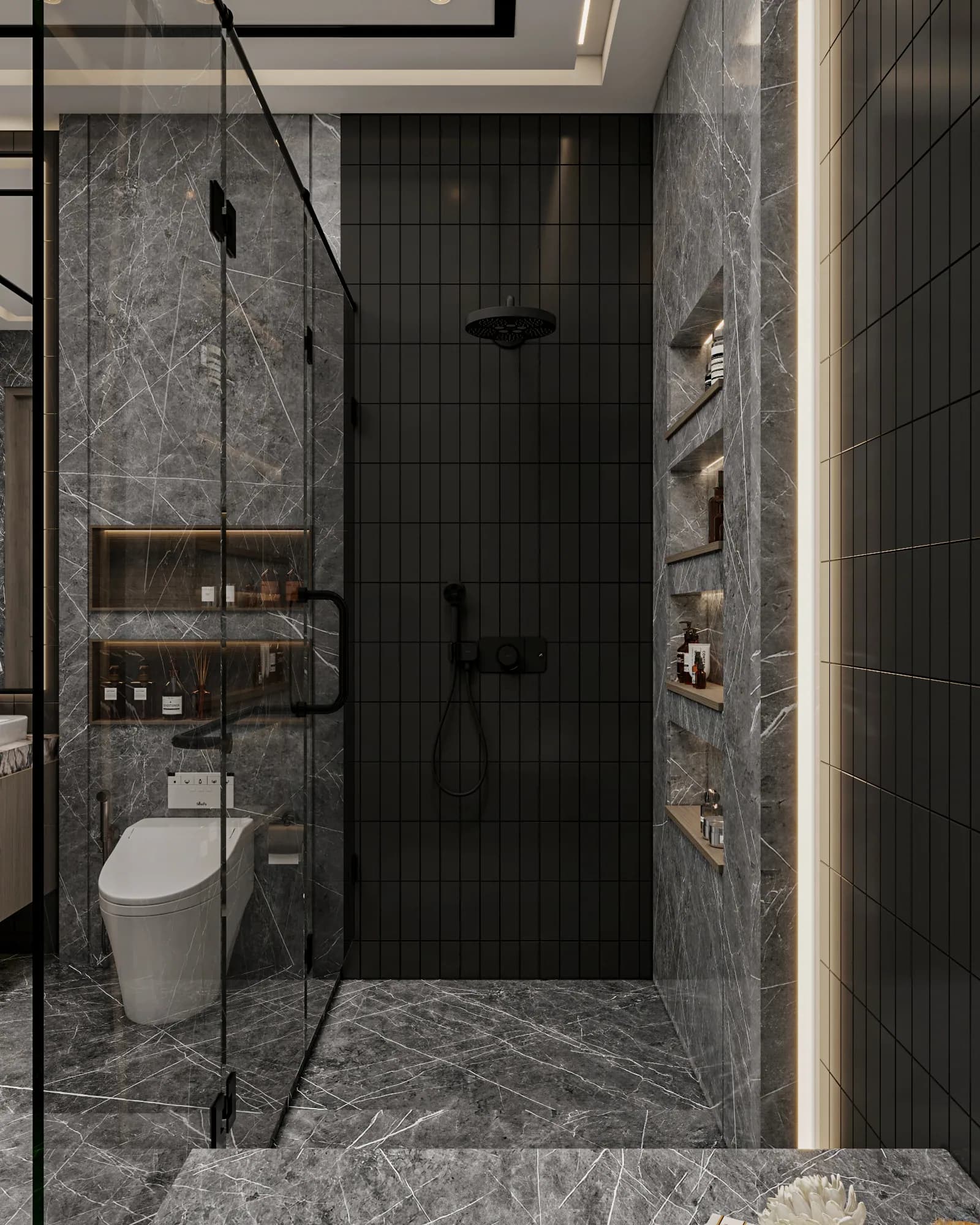 Family Residence: The shower's black tiled wall carries overhead and handheld fittings beside a vertical stack of illuminated niches in a veined wall.