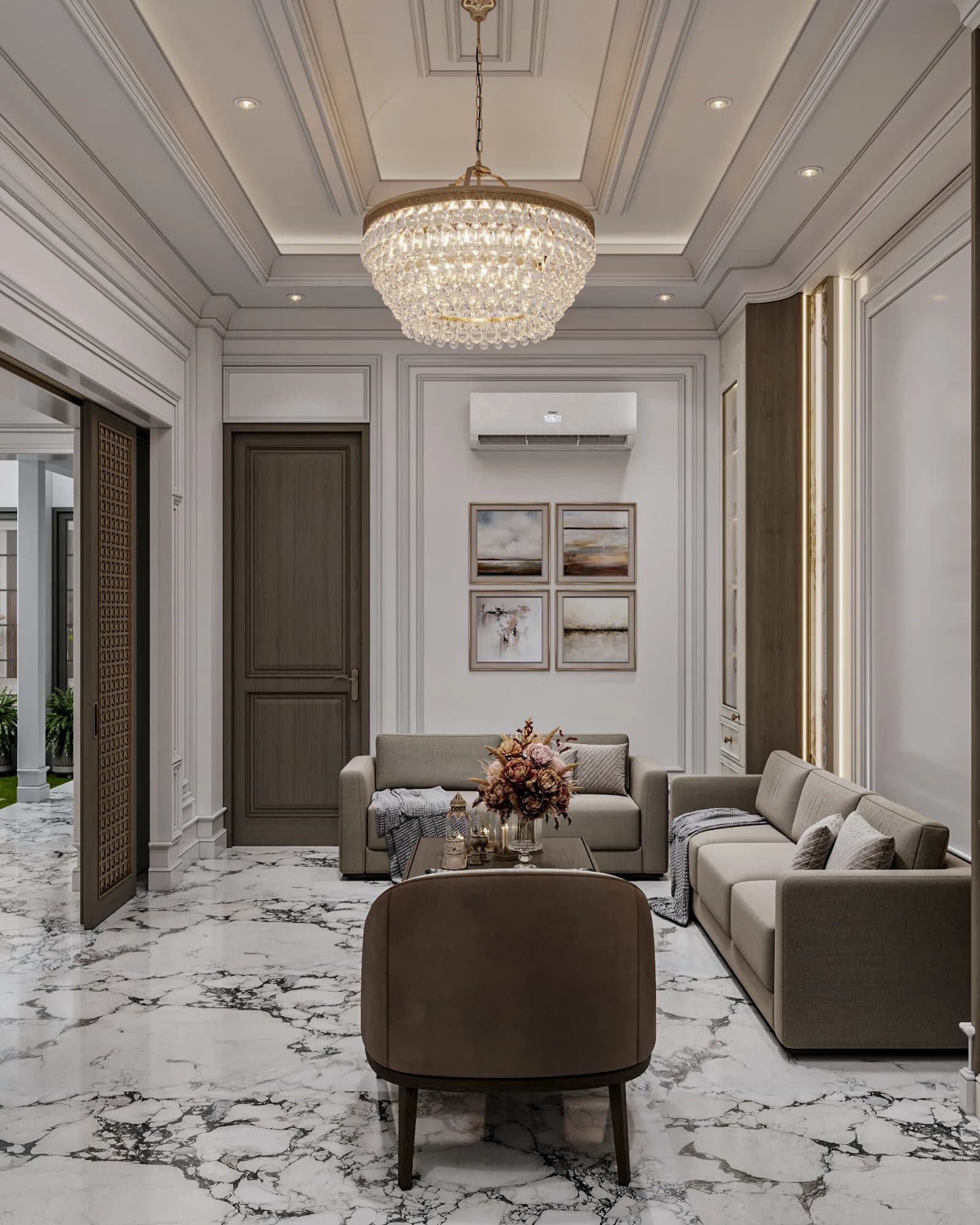 Family Residence: A tiered circular chandelier hangs over two sofas and a curved-back armchair, with four framed artworks above the rear sofa.