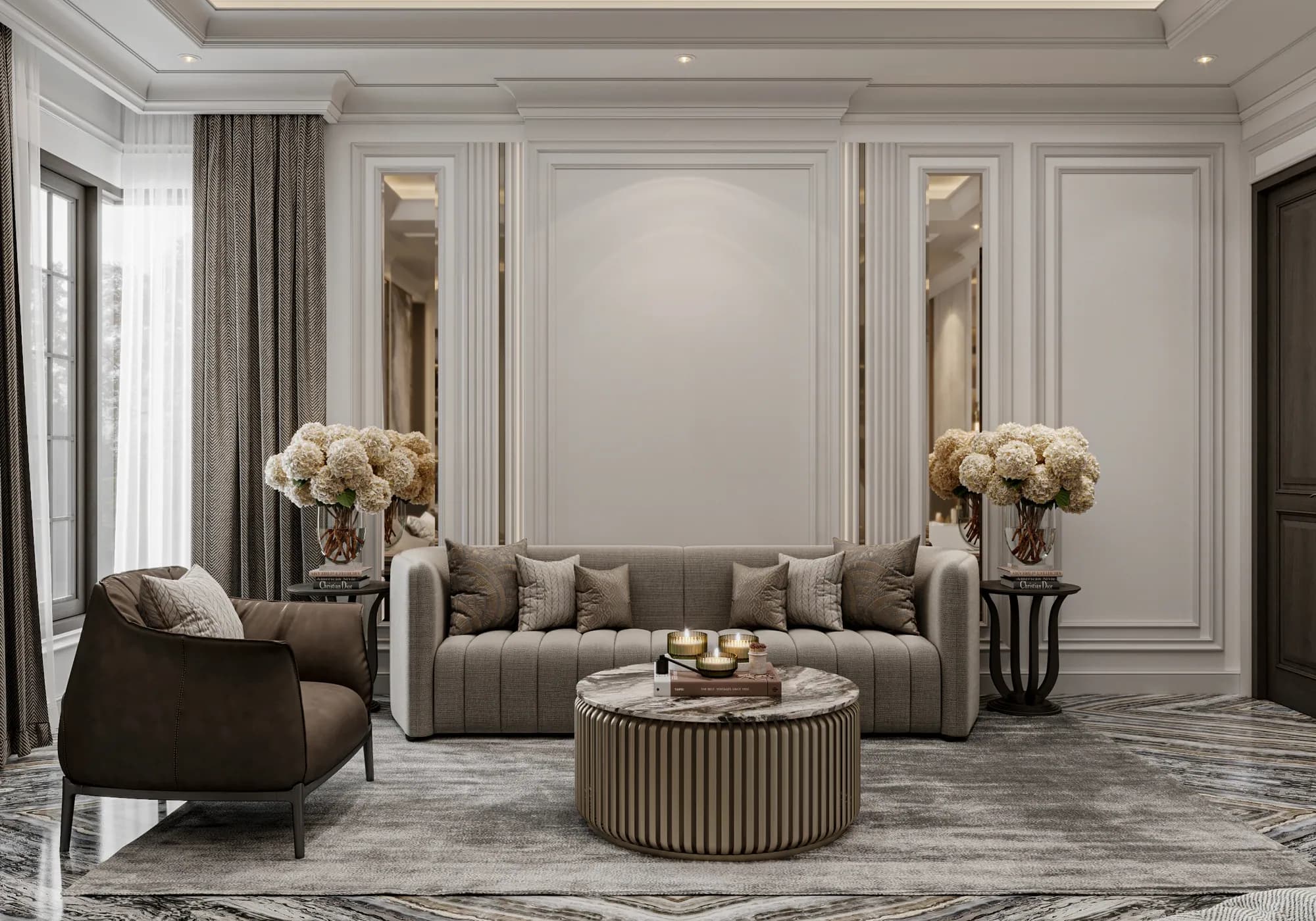 Family Residence: The master suite's sitting area pairs a channelled sofa and curved armchair with a round fluted coffee table, framed by tall mirrors and floral side tables.