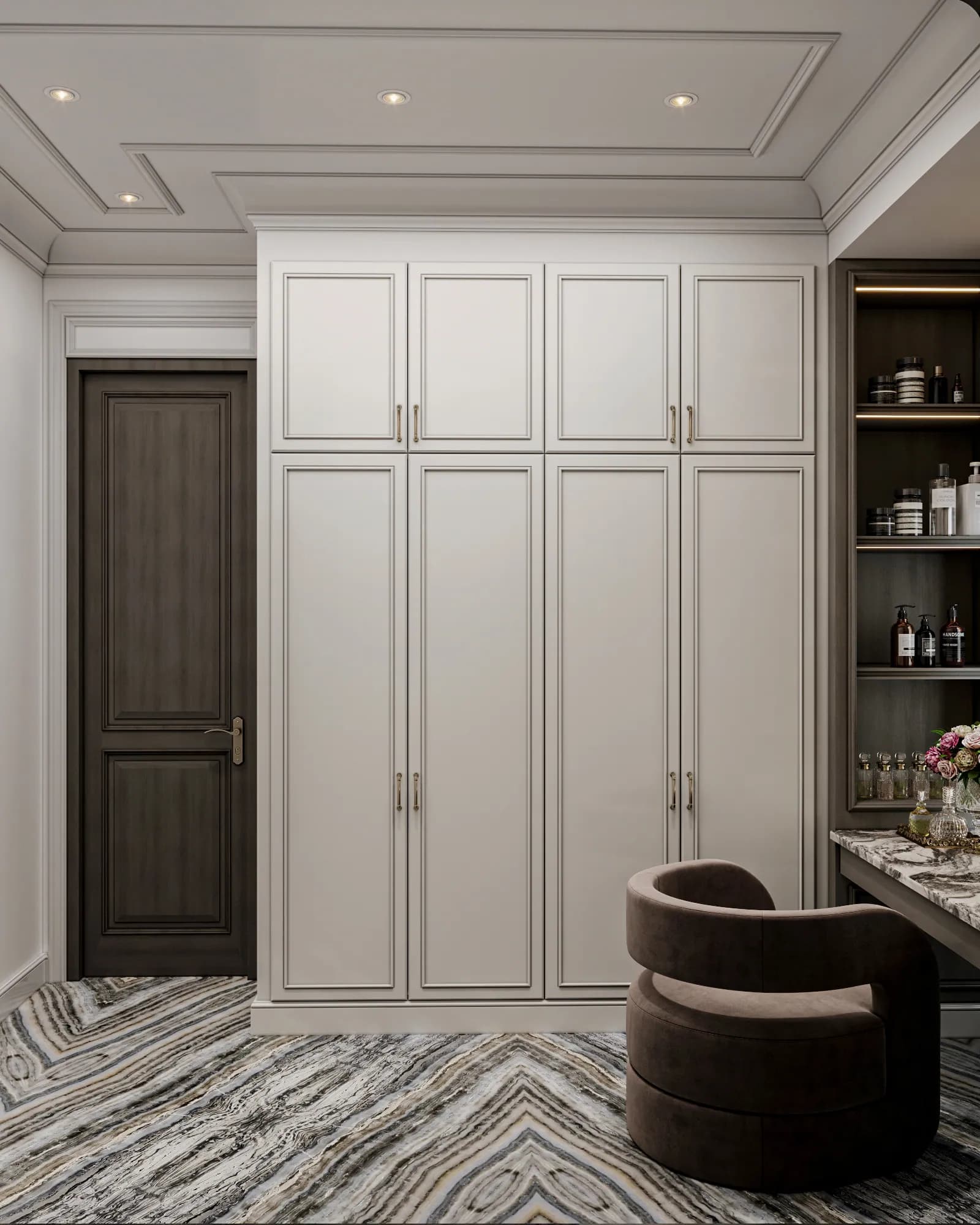 Family Residence: Panelled wardrobe doors and overhead cupboards line the dressing area, beside open shelves and an upholstered chair at the vanity.