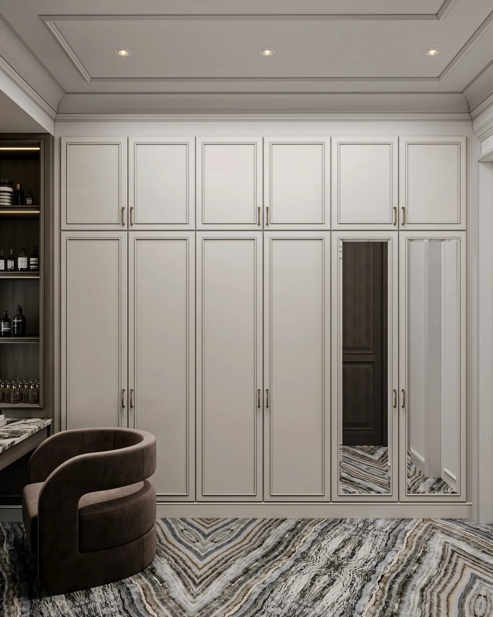 Family Residence: Two full-length mirrored wardrobe doors punctuate the pale panelled storage wall, above flooring with a pronounced chevron-like vein pattern.